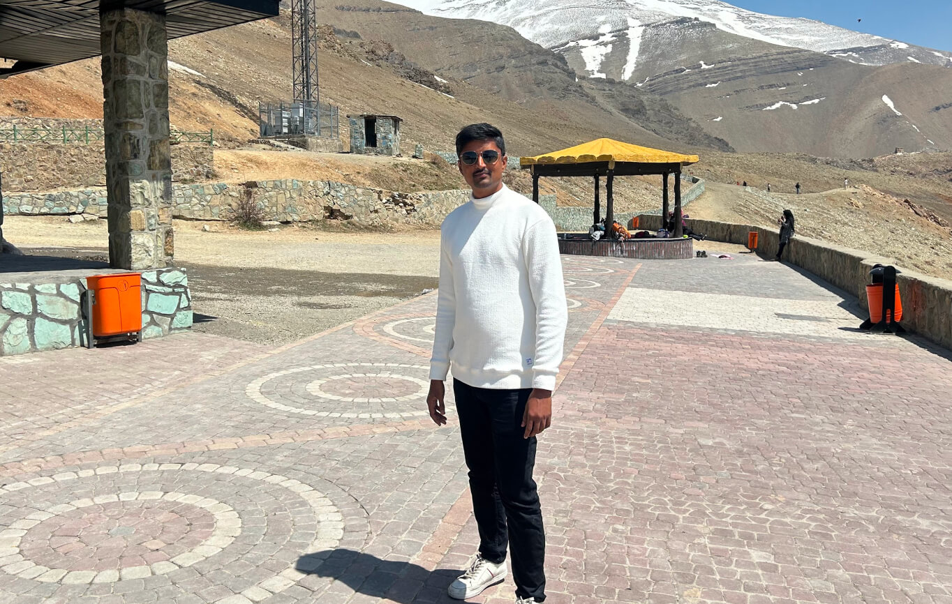 Vasanth visiting a high-altitude mountain landscape