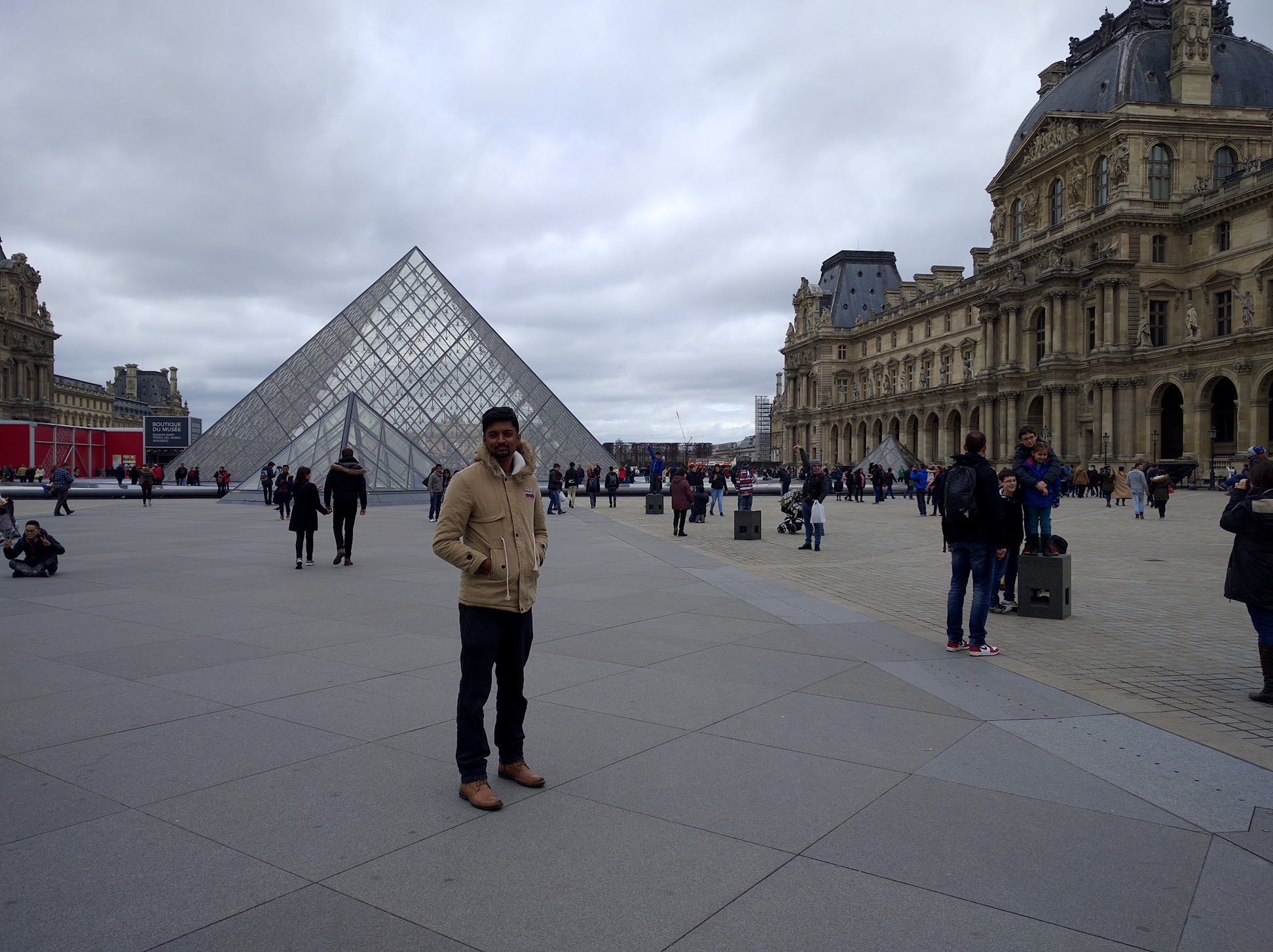 Vasanth visiting the Louvre courtyard in Paris